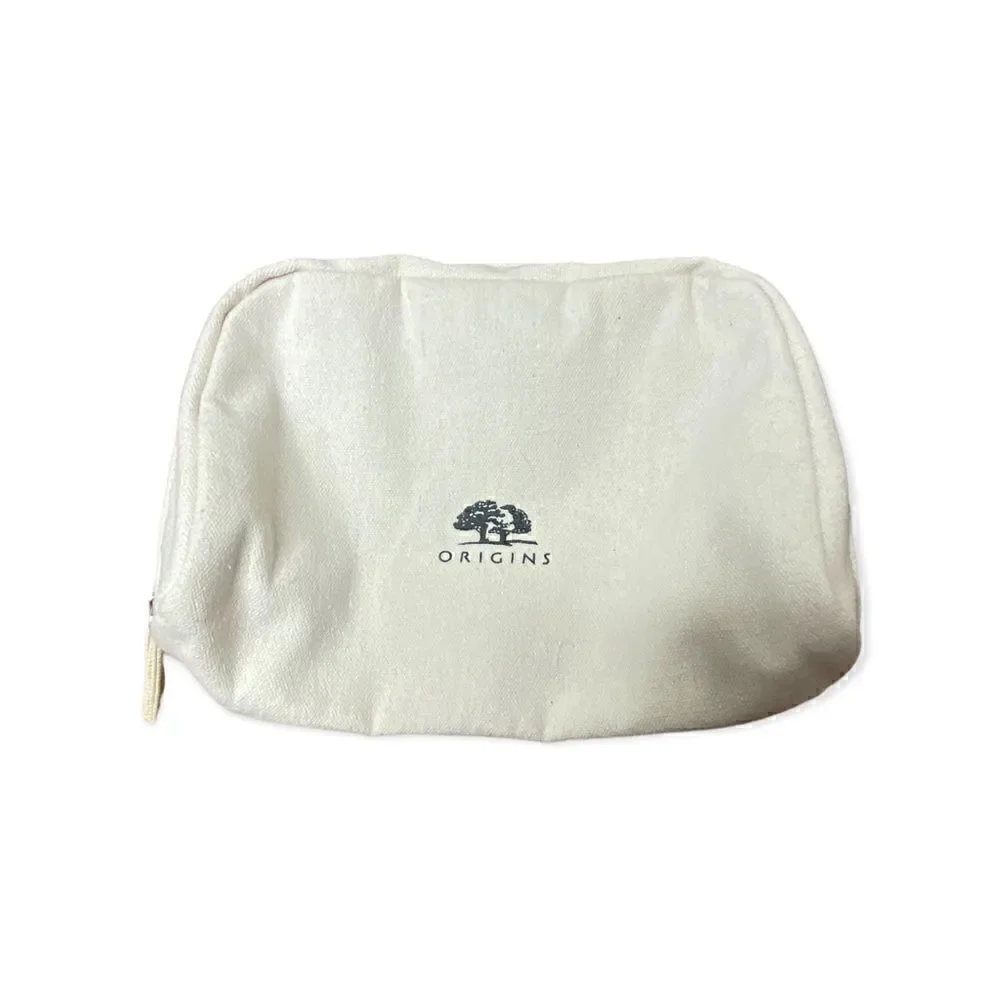 Origins cream canvas make up bag with zip closure small marks inside